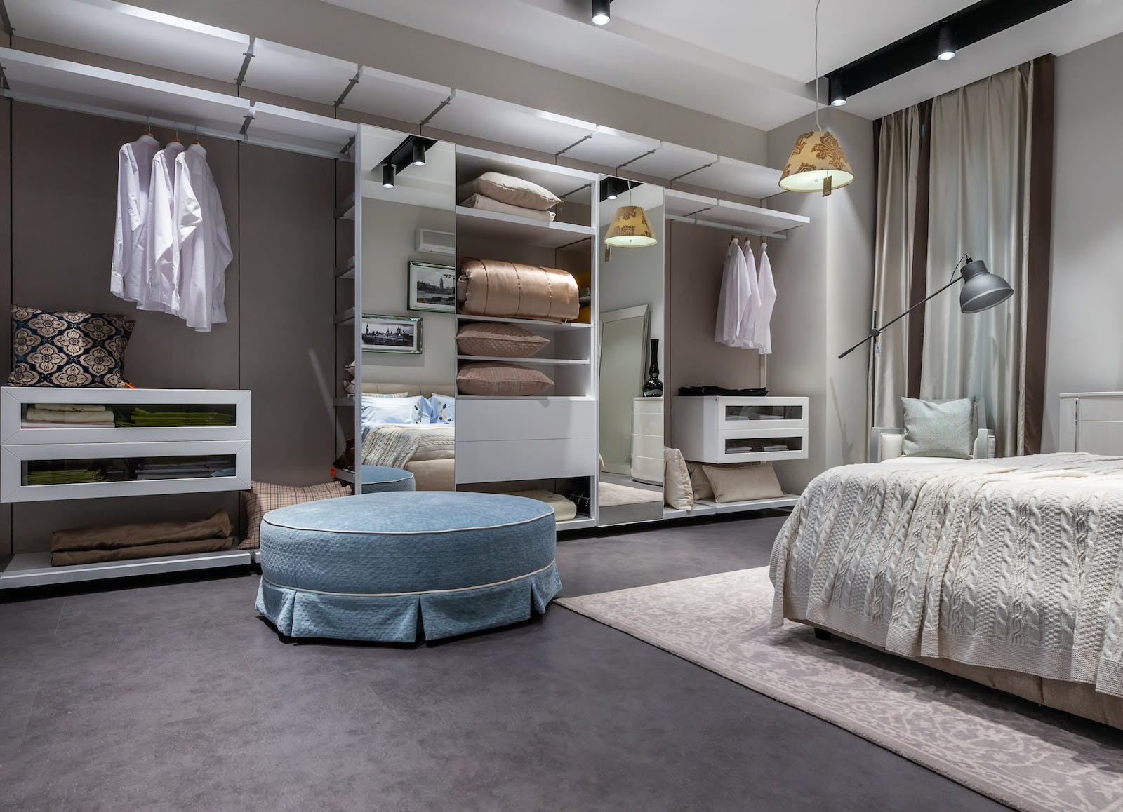 Interior of design of modern bedroom with comfortable bed carpet and built in wardrobe